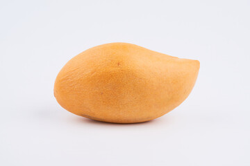 Whole orange thai mango isolated on white background, clipping path