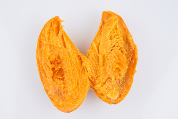 Cut in half orange thai mango isolated on white background, clipping path