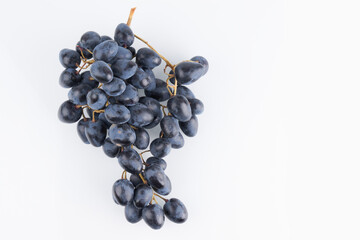 Bunch of black grapes isolated on white background with copy space, clipping path