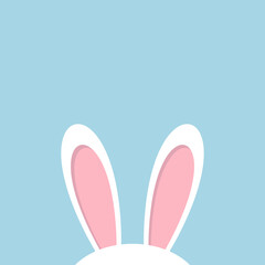 rabbit ears on blue background copy space. beautiful cute easter card
