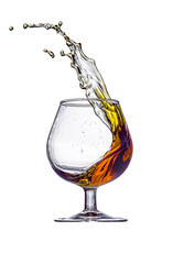A splash of brandy in a glass glass isolated on a white background.
