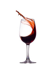 A splash of red liquid in a glass glass isolated on a white background.