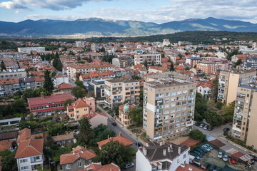 Fototapeta na wymiar Drone view of residential building in Kazanlak town, Bulgaria, view with Balkan mountains on background