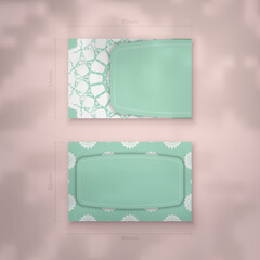 Business card in mint color with abstract white pattern for your contacts.
