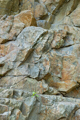 Destruction of the rock of the mountain after the explosion. Cracks in the granite rock due to human activity. Concept of environmental problems