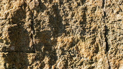 Destruction of the rock of the mountain after the explosion. Cracks in the granite rock due to human activity. Concept of environmental problems