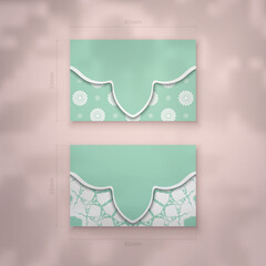 Business card in mint color with luxury white pattern for your business.