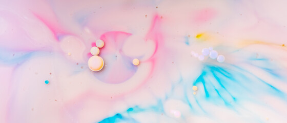 Oil drops in water on a colored background. Abstract pastel bubble background. Abstract fluid...