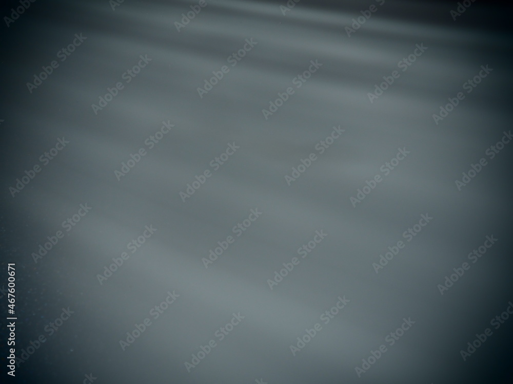Poster diagonal rays of light on a gray background. blurred abstract background light effect, light leaks. 