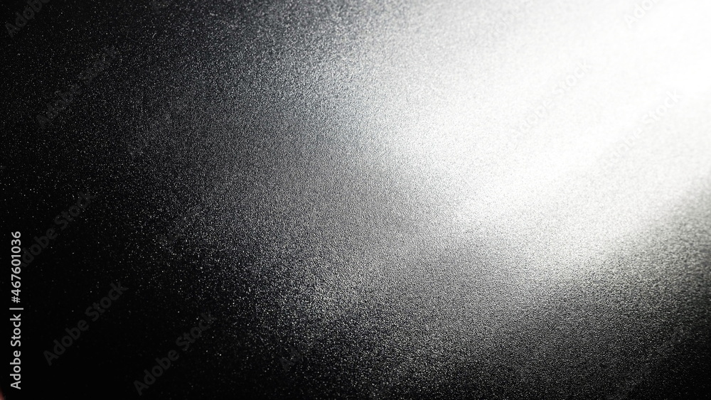 Poster white bokeh and beam on a black background. blurred glow from above on a dark surface. night or spac