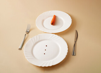 Snowman made with plates, fork, knife and carrot. Minimal, New Year, Christmas, creative idea on pastel background.