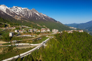 Fototapeta na wymiar North Caucasus. Olympic village on North Caucasus. Ski resort Rosa Khutor.. Aerial view.