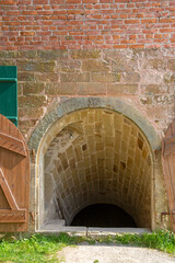 Spooky entrance into an old vaulted cellar