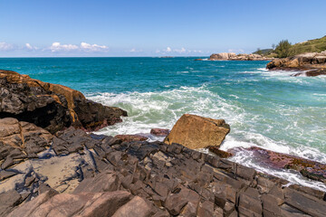 Rocks, Waves and sand on the beach