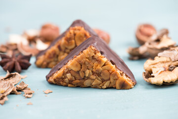 Nut corner, traditional german sweets called Nussecke, covered with chocolate, christmas baking