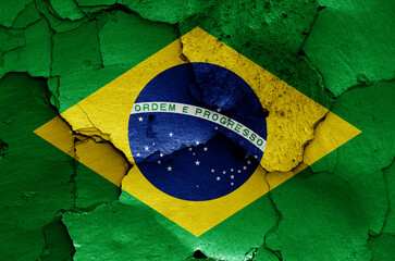 flag of Brazil painted on cracked wall