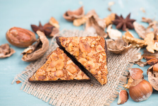 Nut corner, traditional german sweets called Nussecke, covered with chocolate, christmas baking