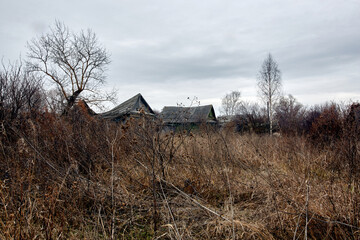 Old abandoned wooden houses in a Russian village.