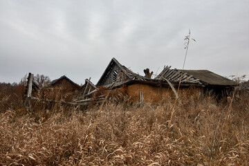 Old abandoned wooden houses in a Russian village.
