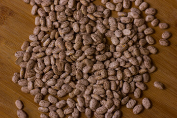 Beans on a wooden background.