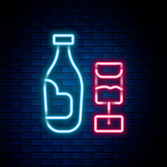 Glowing neon line Wine bottle with glass icon isolated on brick wall background. Colorful outline concept. Vector