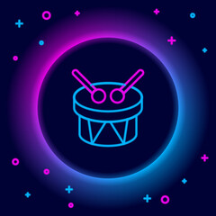 Glowing neon line Musical instrument drum and drum sticks icon isolated on black background. Colorful outline concept. Vector