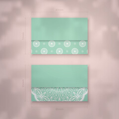 Mint color business card template with abstract white ornament for your personality.