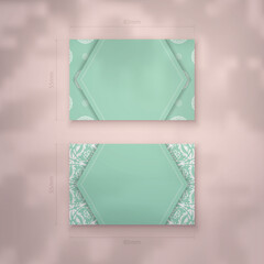 Mint color business card template with Greek white pattern for your personality.