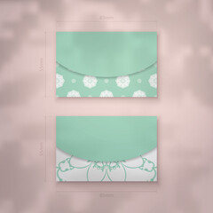 Mint color business card template with luxurious white pattern for your brand.