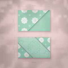 Mint color business card template with vintage white ornament for your brand.