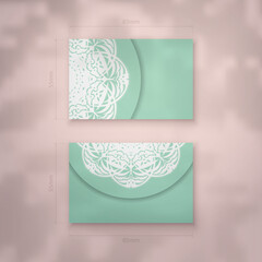 Mint color business card with abstract white ornament for your business.