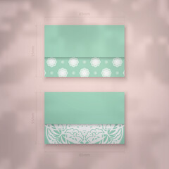 Mint color business card with Greek white pattern for your personality.