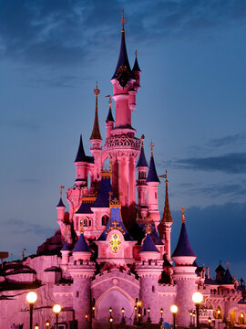 Paris, France - April 2019: Night performance near Sleeping Beauty castle in Disneyland Paris. Disneyland Paris (Euro Disney Resort) - entertainment resort in Marne-la-Vallee. Marne-la-Vallee,