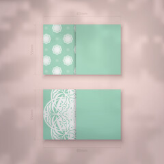Mint color business card with Indian white pattern for your business.
