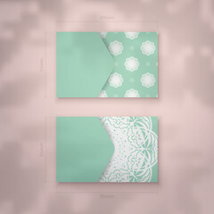 Mint color business card with Indian white pattern for your personality.