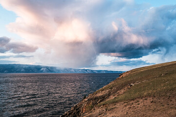 Fototapeta na wymiar Beautiful red sunset on a hill in Khuzir, Olkhon Island, Baikal lake