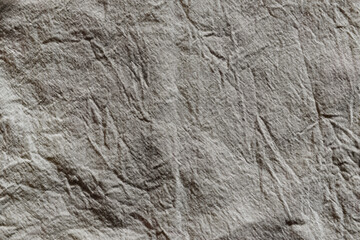Crumpled white fabric surface texture background