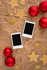 Greeting card composition with two blank instant photo frames and xmas decorations. Happy New Year, Merry Christmas, winter holidays background. Design template, copy space, empty polaroid mockup.