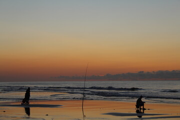 Fishing in the Ocean During Sunrise