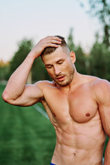 man with pumped up muscular body outdoors health workout