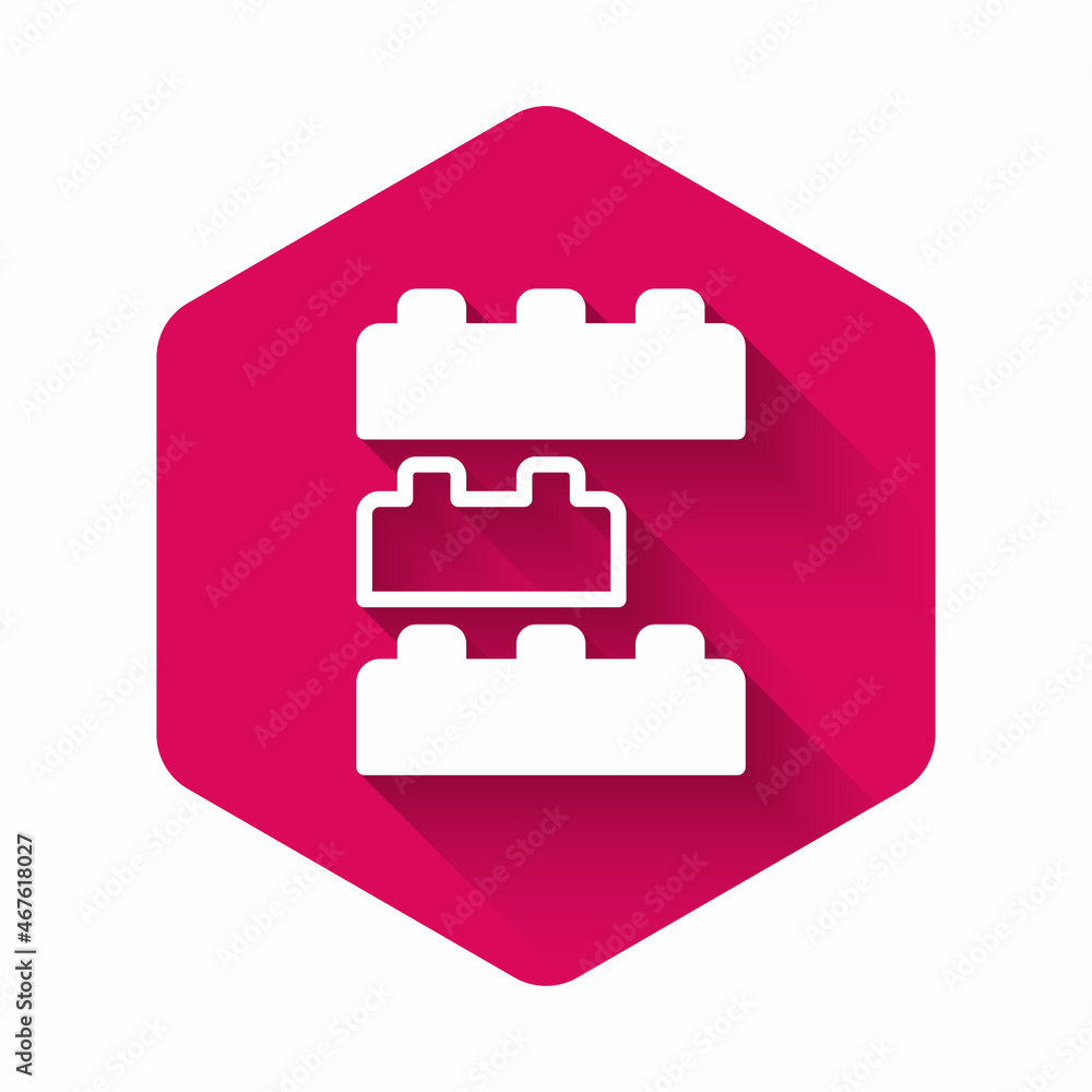 Poster white toy building block bricks for children icon isolated with long shadow background. pink hexagon