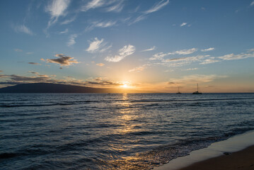Beautiful Maui sunset with sun setting behind Lanai, Hawaii