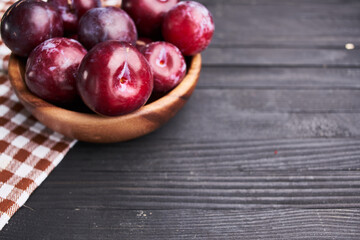 plums fruits natural products on a wooden table top view