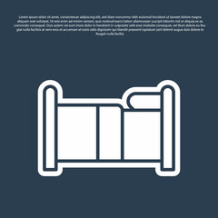 Blue line Bed icon isolated on blue background. Vector