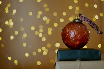 Christmas background decorated with some gifts and red Christmas ball and with background lights. Stylish and minimalist decoration for product decoration assembly.