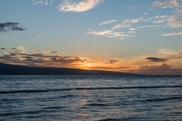 Beautiful Maui sunset with sun setting behind Lanai, Hawaii