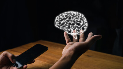 Close up of a businessman holding a digital image of the brain in the palm. creative idea. Concept of idea and innovation, Virtual reality man with symbol neurons in the brain.