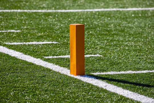 Football field end zone with lines and pylon