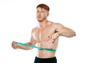 athletic man with measuring tape muscle workout