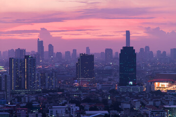 Bangkok downtown cityscape with skyscrapers at evening give the city a modern style. No focus,...